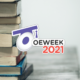 Books overlaid by the logo of OEWeek2021