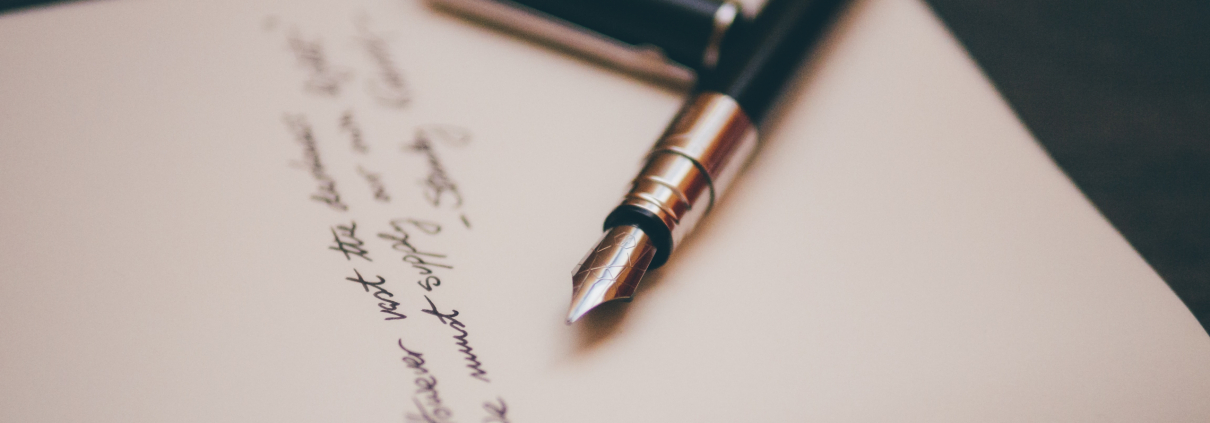 Paper with fountain pen and cursive writing