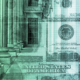 A government building fading into set of 100-dollar bills